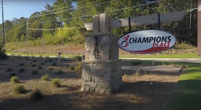 sign in front of Champions Place