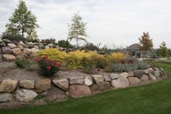 Landscaping along a berm wall