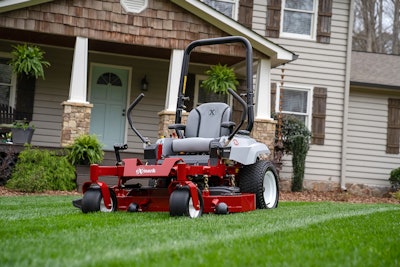 Exmark radius zero turn mower on front lawn of house