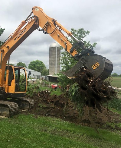 PowerGrip Bucket attachment picking up tree