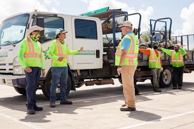 Yellowstone Landscape professionals talking outside of landscaping truck