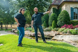 Landscaping professional speaking with client