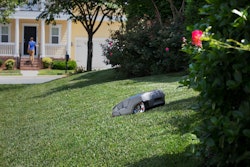 autonomous mower in yard