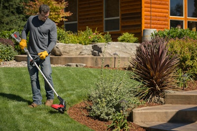 man edging lawn