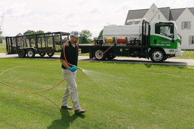technician spraying lawn
