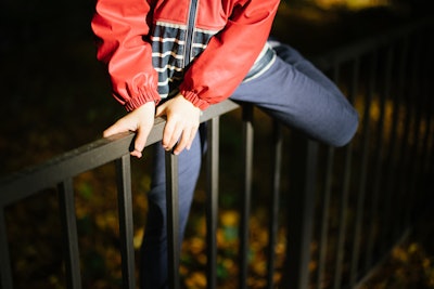 person jumping a fence