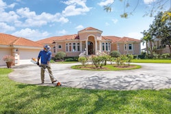 lawn care professional edging lawn