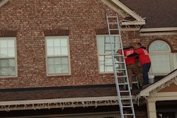aaron brazell and omega landscaping adding christmas lights to house