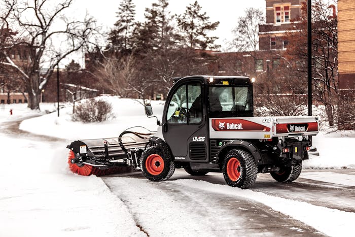 Bobcat Toolcat utility work machine with angle broom clearing snow