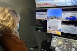 Equipment World's Jordanne Waldschmidt remotely operates a skid steer in North Carolina from the Las Vegas Convention Center.
