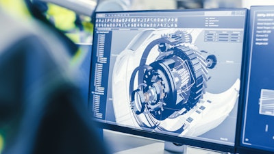 Engineer looking at an engine design on a computer screen.