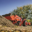 Kubuto L-Series Tractor with bucket full of dirt.