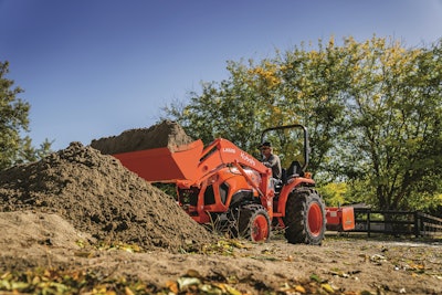 Kubuto L-Series Tractor with bucket full of dirt.