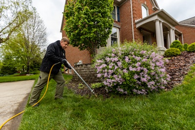 Oasis Turf & Tree's Keith Hayes performing deep root feeding