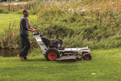 Landscaper using the Bobcat WB700 walk-behind mower