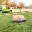 husqvarna robotic mower on a residential lawn