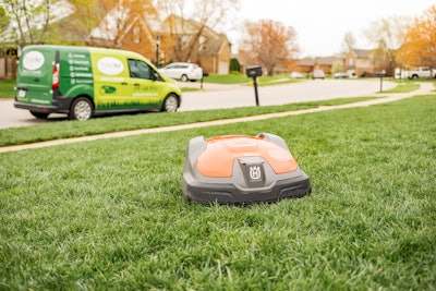 husqvarna robotic mower on a residential lawn