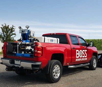 red boss truck with deicing equipment setup in the truck's bed.