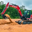Yanmar SV100-2A mini excavator scooping dirt
