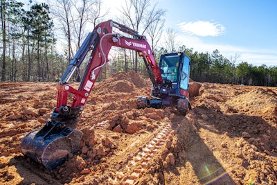 Yanmar ViO35 compact excavator digging mud