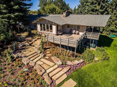 house with landscaping under deck