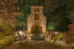 Outdoor fireplace and patio area