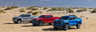 2023 Chevy Colorado lineup three models parked in desert gray red blue