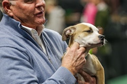 Kris Kiser holds puppy