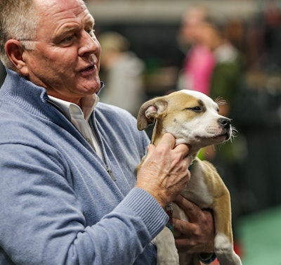 Kris Kiser holds puppy