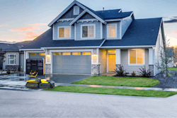 snow removal robot in front of a house