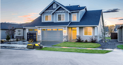 snow removal robot in front of a house