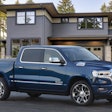 2023 Ram 1500 Limited Elite blue parked in front of house