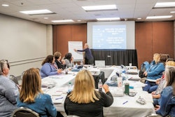Judy pointing at board
