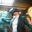 Man in a suit wearing a virtual reality headset