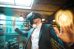 Man in a suit wearing a virtual reality headset