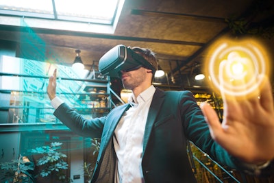 Man in a suit wearing a virtual reality headset