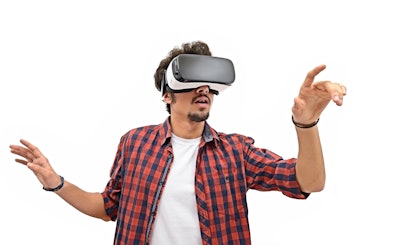 Man in a plaid shirt wearing a virtual reality headset
