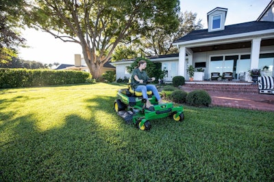 JD Z trak riding mower being used to cut a lawn