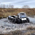 Fat Truck 8x8 amphibious vehicle crossing a river