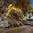 EW100 Wacker excavator digging on trail