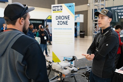 two men discussing drone technology