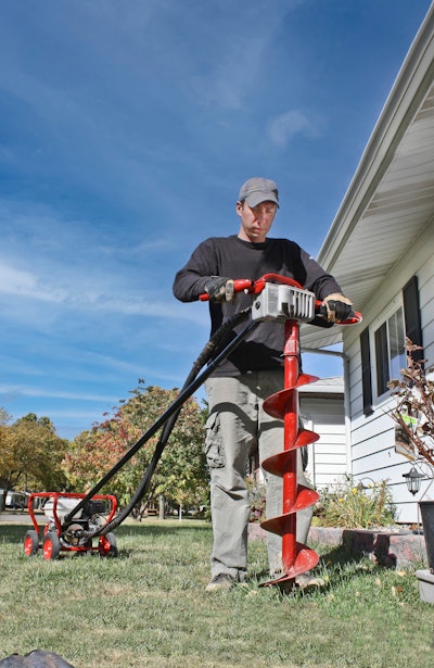 man with mechanical drill