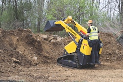New Holland C314 mini track loader bucket raised over dirt pile