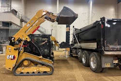 Cat 255 and 265 Compact Track Loaders loading dump truck
