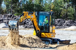 JCB 35X1 mini excavator dumping dirt