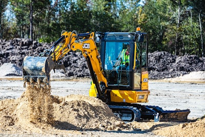 JCB 35X1 mini excavator dumping dirt