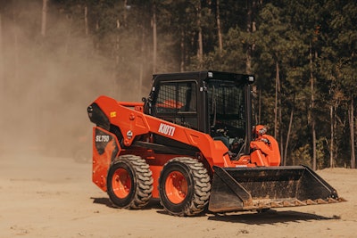 Kioti SL750 skid steer kicking up dust