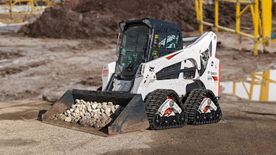 Mattracks rt125 tc tracks on bobcat s770 bucket loaded with rocks