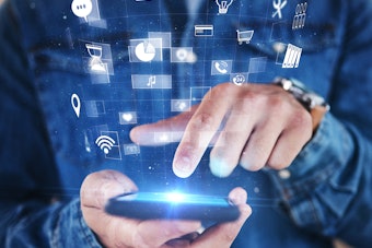 Man using apps on his smartphone