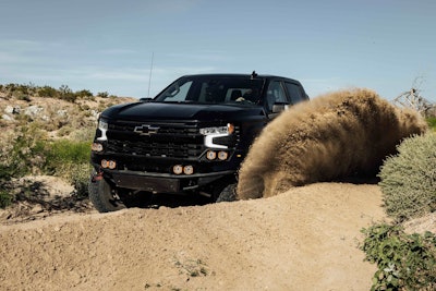 Fox Factory Edition 2024 Chevy Silverado kicking up desert sand